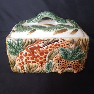 Trinket box with Monkey riding a giraffe, elephant, zebra and leopard.